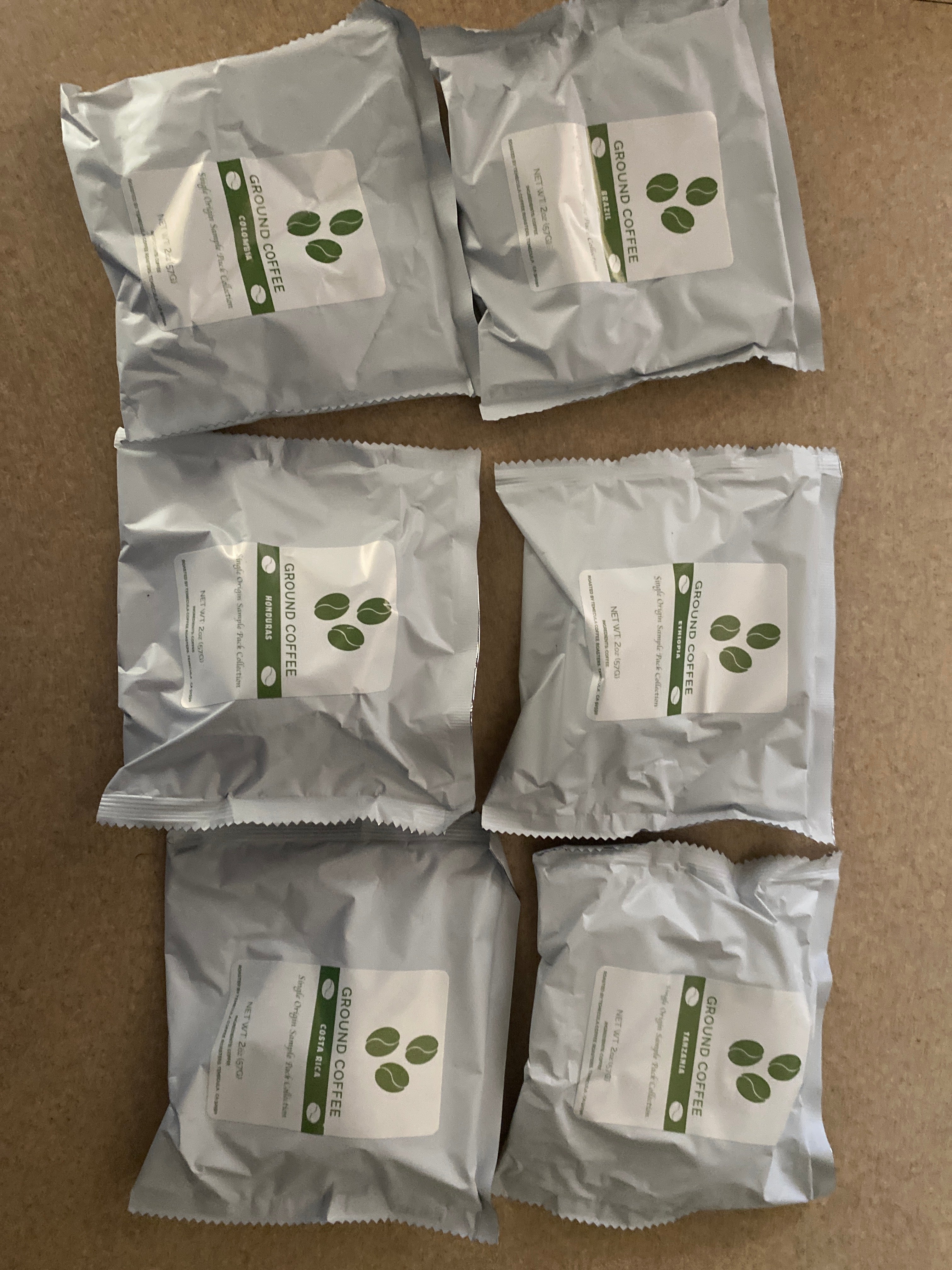 Single Origin Coffee Sample Pack featuring six 2oz coffee packs for tasting different flavor profiles.